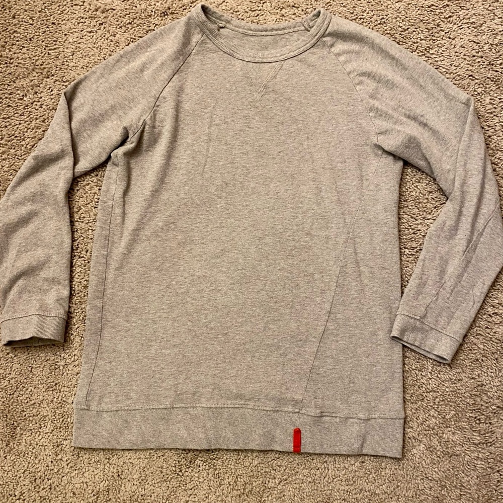 Grey women’s long sleeve top.